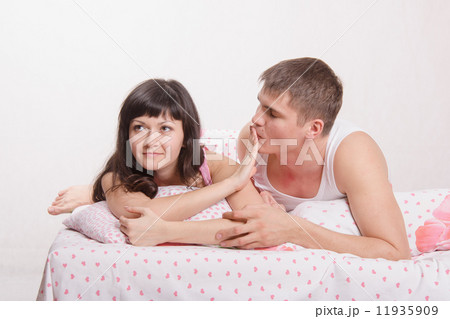 Young girl refuses to kiss a guy in bed 11935909