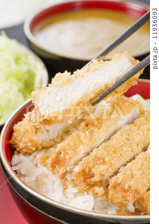 Tonkatsu - Japanese breaded, deep-fried pork cutlet on top of boiled rice. 11936093