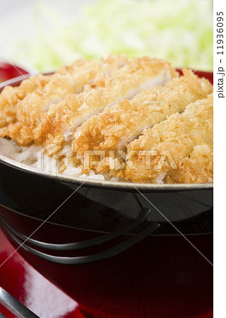 Tonkatsu - Japanese breaded, deep-fried pork cutlet on top of boiled rice. Tonkatsu - Japanese breaded, deep-fried pork cutlet on top of boiled rice. 11936095