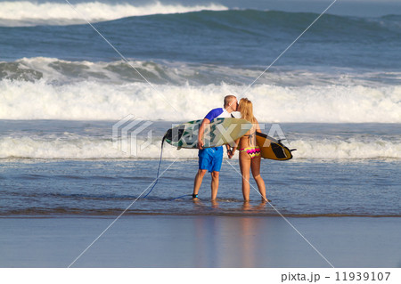 Surfers on Beach Having Fun in Summer. 11939107