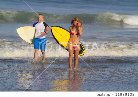 Surfers on Beach Having Fun in Summer. 11939108