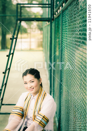 The female graduation portrait in academic gown is looking forwa The female graduation portrait in academic gown is looking forwa 11941650