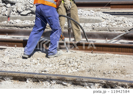 Two Workers with pneumatic hammer 11942584