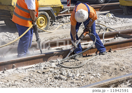 Two Workers with pneumatic hammer Two Workers with pneumatic hammer 11942591