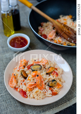 Spanish dish paella with seafood, shrimps in pan 11950328