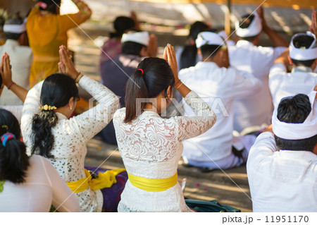 Young Balinese women praying in a temple 11951170