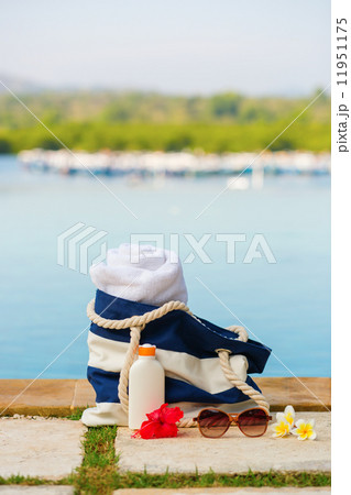 Beach bag, towel, sunscreen and sunglasses 11951175