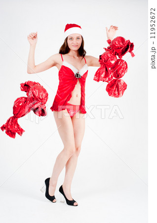 Beautiful and sexy christmas woman with sweets Beautiful and sexy christmas woman with sweets 11952672