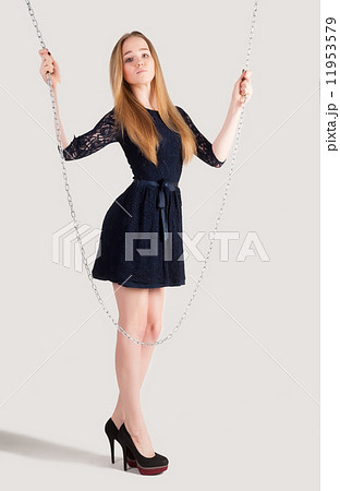 beautiful fashionable woman near chain swing 11953579