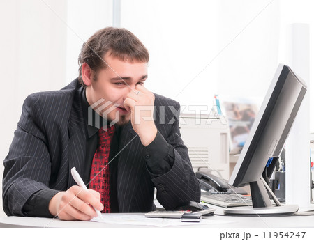 young businessman on workplace in office young businessman on workplace in office 11954247
