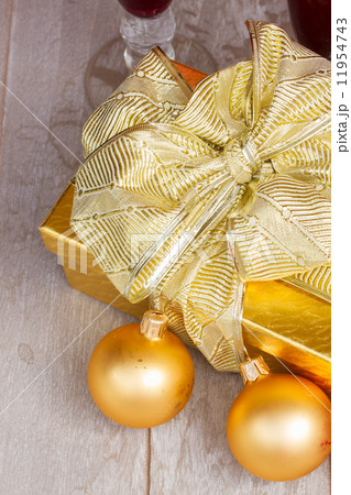 golden gift box with christmas decorations golden gift box with christmas decorations 11954743