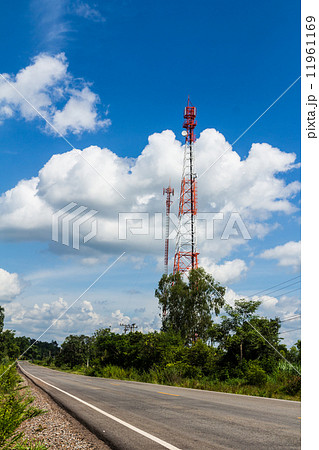 Cell phone and communication towers against blue sky Cell phone and communication towers against blue sky 11961169