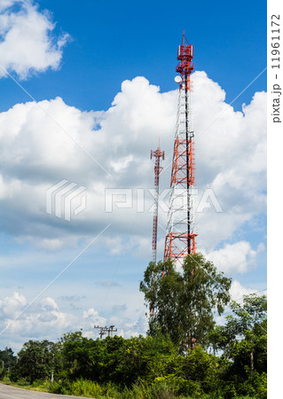 Cell phone and communication towers against blue sky Cell phone and communication towers against blue sky 11961172