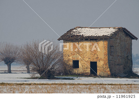 Old brick house covered by snow Old brick house covered by snow 11961925