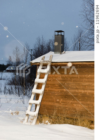 ladder on wooden hut lapland in winter 11962694