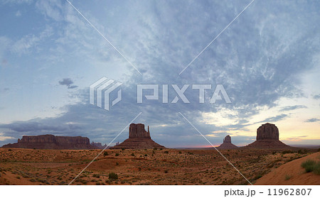 Monument Valley view at sunset with wonderfull cloudy sky and lights on mittens 11962807