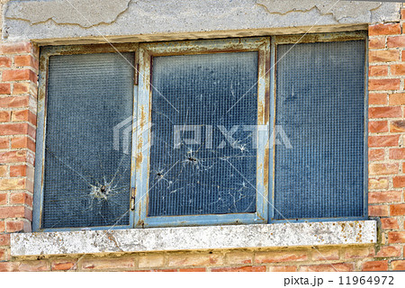 bullet holes on glass window bullet holes on glass window 11964972