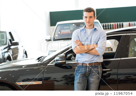 man standing near a car 11967054
