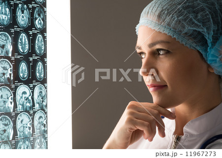 doctor looking at the x-ray 11967273