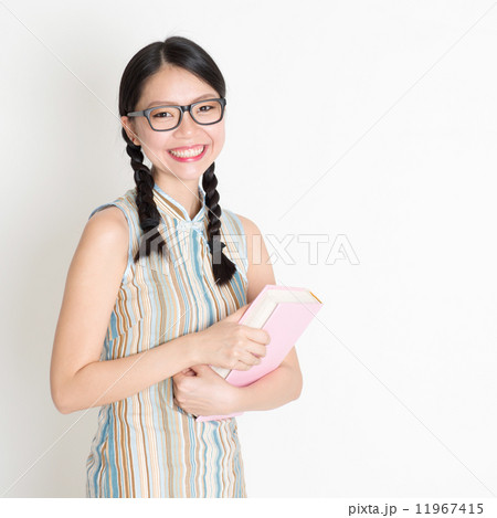 Asian Chinese school girl hands holding text books Asian Chinese school girl hands holding text books 11967415