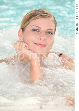Woman relaxing in jacuzzi 11972438
