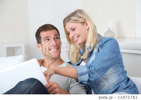 Couple at home with laptop computer 11972781