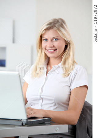 Closeup of blond woman in the office 11972972