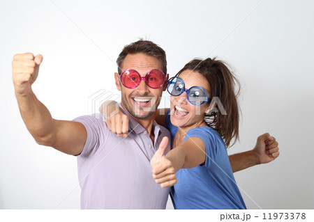 Couple with funny glasses Couple with funny glasses 11973378