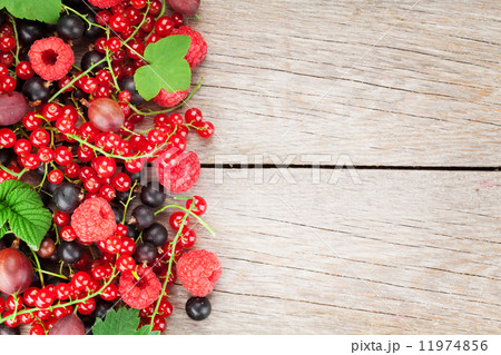 Fresh ripe berries on wooden table Fresh ripe berries on wooden table 11974856