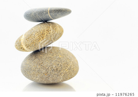 Pyramid of stones over white 11976265