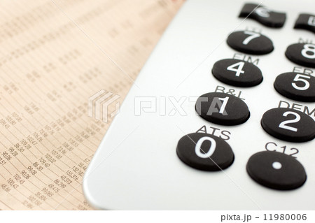financial newspaper with calculator 11980006
