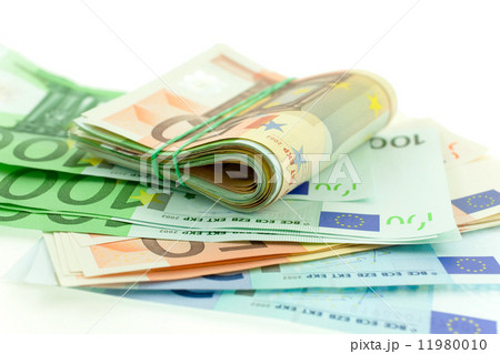 rolled with rubber euro notes on white background 11980010