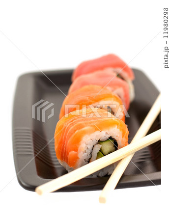 four rolls on a black plate four rolls on a black plate 11980298