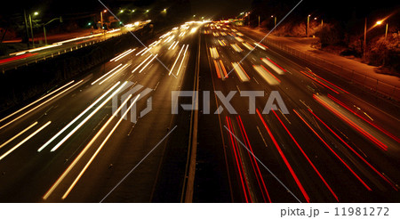 Highway Traffic at night with carlights passing by 11981272