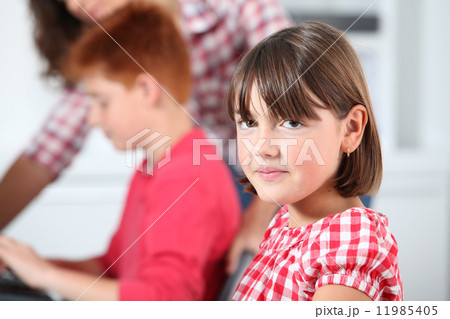 Closeup of young girl in classroom 11985405