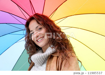 Woman holding colorful umbrella Woman holding colorful umbrella 11985537