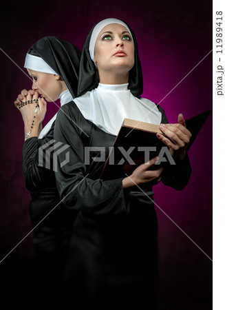 Two attractive young nuns  11989418