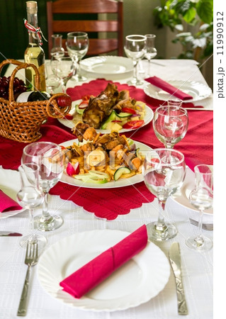 Laid table with food 11990912