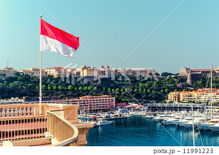 National flag of of the Principality of Monaco and view of port National flag of of the Principality of Monaco and view of port 11991223