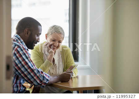 A man and woman in an office A man and woman in an office 11995327