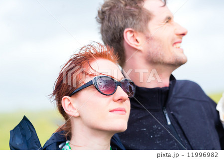 Couple in summer rain at sea coast Couple in summer rain at sea coast 11996982