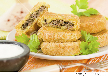 Batata Chap - Middle Eastern potato croquette filled with lamb. Arab traditional street food. 11997699