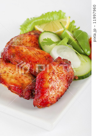 Hot Wings - Spicy and hot chicken wings served with salad. 11997960