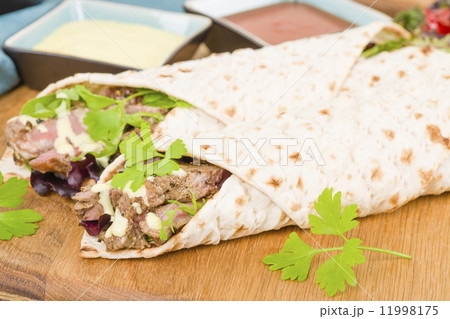 Grilled Beef Wraps - Griddled sirloin steak, sliced and served on a flatbread. 11998175