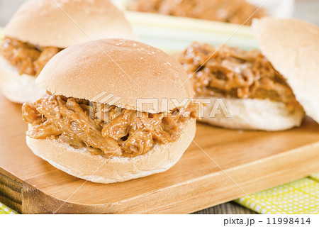 Pulled Pork Sliders - Juicy slow roasted pork meat in a white buns. 11998414