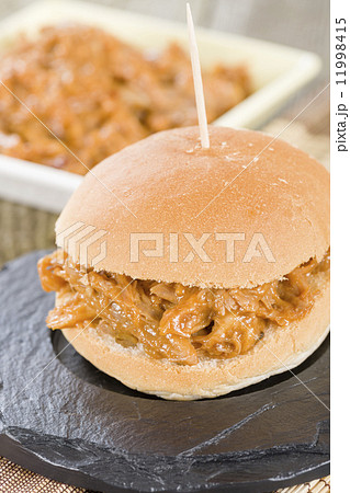 Pulled Pork Sliders - Juicy slow roasted pork meat in a white buns. 11998415