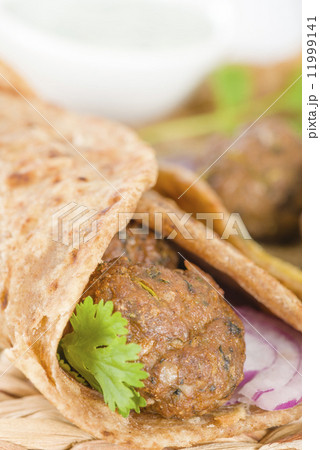 Kati Roll - Kofta kebabs and red onion pickle rolled in a paratha fried with eggs. 11999141