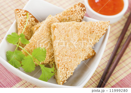 Hatosi (Prawn Toast) - Chinese toasted bread with minced shrimp and sesame seeds. Hatosi (Prawn Toast) - Chinese toasted bread with minced shrimp and sesame seeds. 11999280