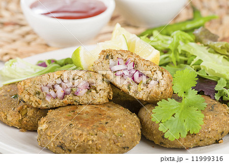 Shami Kebab - Minced meat and chana dal patties stuffed with red onion pickle. Shami Kebab - Minced meat and chana dal patties stuffed with red onion pickle. 11999316