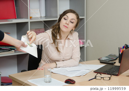 Head looks bribe in an envelope 11999559